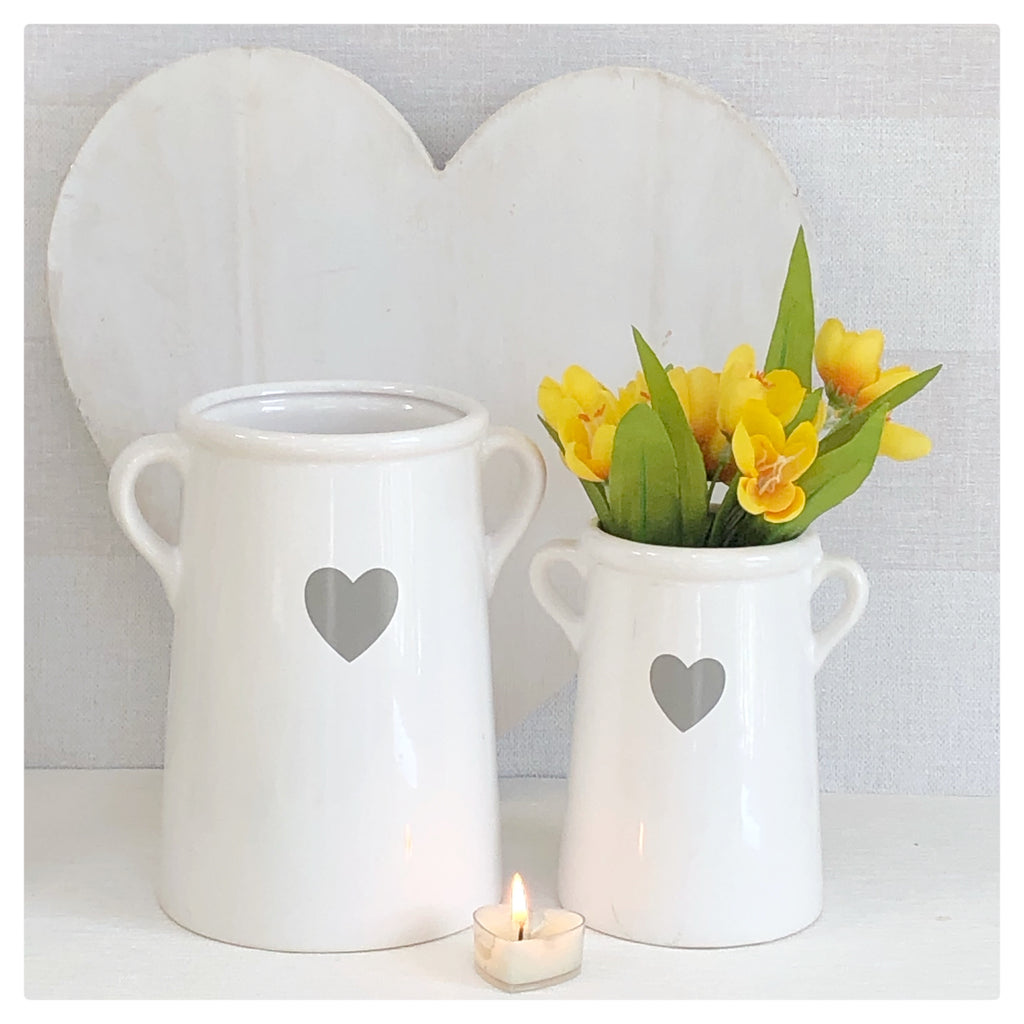 White vase with grey heart
