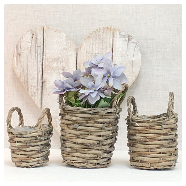 Set of three wicker planter baskets